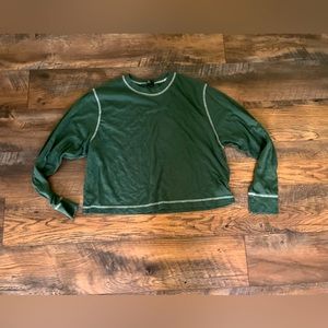 Green, long sleeve shirt.